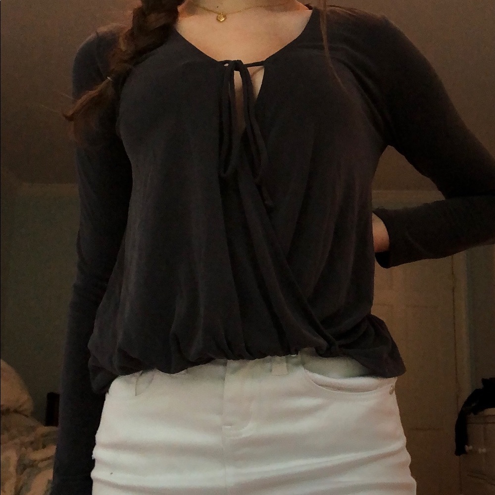 an extra small long sleeved grey blouse